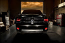 Front end of a RAM truck with Switchback Quad Pre-Assembled Halo Headlights installed and red halos on.