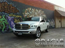 Three quarters view of a Dodge Ram with white LED headlight halo rings installed.