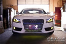 Front view of an Audi A5 with yellow LED headlight and fog light halo rings installed.