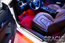 Audi interior with red ambient footwell lighting.