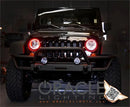 Front end of a Jeep Wrangler JK with red LED headlight halo rings installed.