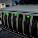 Front end of a Jeep Wrangler JL with green Pre-Runner Style LED Grill Light Kit installed.
