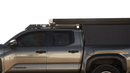 Silver Toyota Tacoma truck with a black bed cover on a white background