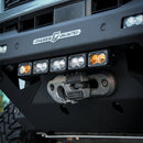 Close-up of a Tacoma's front bumper with LED lights and an RTS Front Winch.