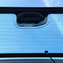 Close-up of a car's sunshade with a blue sky background