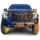 Front view of a blue GMC Sierra 1500 with an RTS “Rugged Terrain Series” Front Winch Bumper on a white background