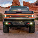Rear view of a Jeep Gladiator JT with multiple LED lighting products shining brightly. Including Flush Mount Tail Lights, High Powered Reverse Lights and Racetrack LED Tailgate Panel.