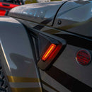 Close-up view of the Sidetrack LED Lighting System installed on a Jeep Wrangler JT, with amber LEDs on.