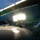 Close-up view of VEGA Series 2 and VEGA Series 4 installed on the hood of a Jeep Gladiator JT. The light pods are turned on and shining brightly.