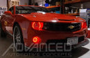 Three quarters view of a Chevrolet Camaro with red LED headlight and fog light halo rings installed.