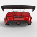 Rear view of a red Toyota Supra with Universal Illuminated LED Letter Badges installed above the license plate area.