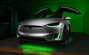 Silver Tesla Model X with green headlight and fog light DRLs.