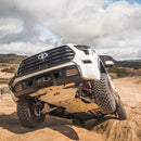 Photo of an airborne 2023 Toyota Sequoia, with the CBI skid plate visible underneath