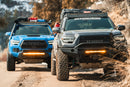 Toyota Tacoma Baja Front Bumpers mounted on two Tacoma.