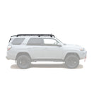 White SUV with roof rack on a white background