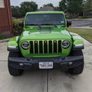 Front end of a Jeep Wrangler JL with amber Pre-Runner Style LED Grill Light Kit installed.