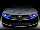 Front end of a Chevrolet Camaro with blue headlight DRLs.