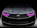 Front end of a Chevrolet Camaro with pink headlight DRLs.