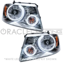 Ford F-150 headlights with white LED halo rings.