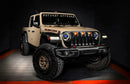 Three quarters view of a Jeep Gladiator JT with blue demon eye projectors.