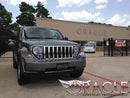Three quarters view of a Jeep Liberty with white LED headlight halo rings installed.