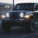 Three quarters view of a Jeep Wrangler JL with bright LED Oculus Headlights installed.