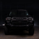 Black Toyota truck in a dark setting