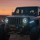Three quarters view of a Jeep with multiple aftermarket lighting products installed, including Oculus Headlights.