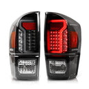 Winjet 2016-23 Toyota Tacoma LED Tail light - Black / Clear / Smoke Glow Bar