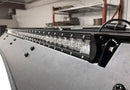 LED light bar on a prinsu pro roof rack on a 4runner in a warehouse setting