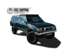 Blue Toyota tacoma xtra cab truck with a prinsu roof rack on a white background