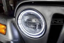 Close-up of white LED halo ring installed on a Jeep.