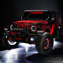 Three quarters view of a red Jeep Wrangler with High Performance 20W LED Fog Lights installed.