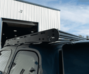 Prinsu Roof rack system on a vehicle with a building and blue sky in the background