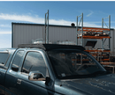 Pickup truck with a roof rack in an industrial setting