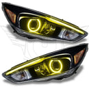 Ford Focus headlights with yellow halo rings.